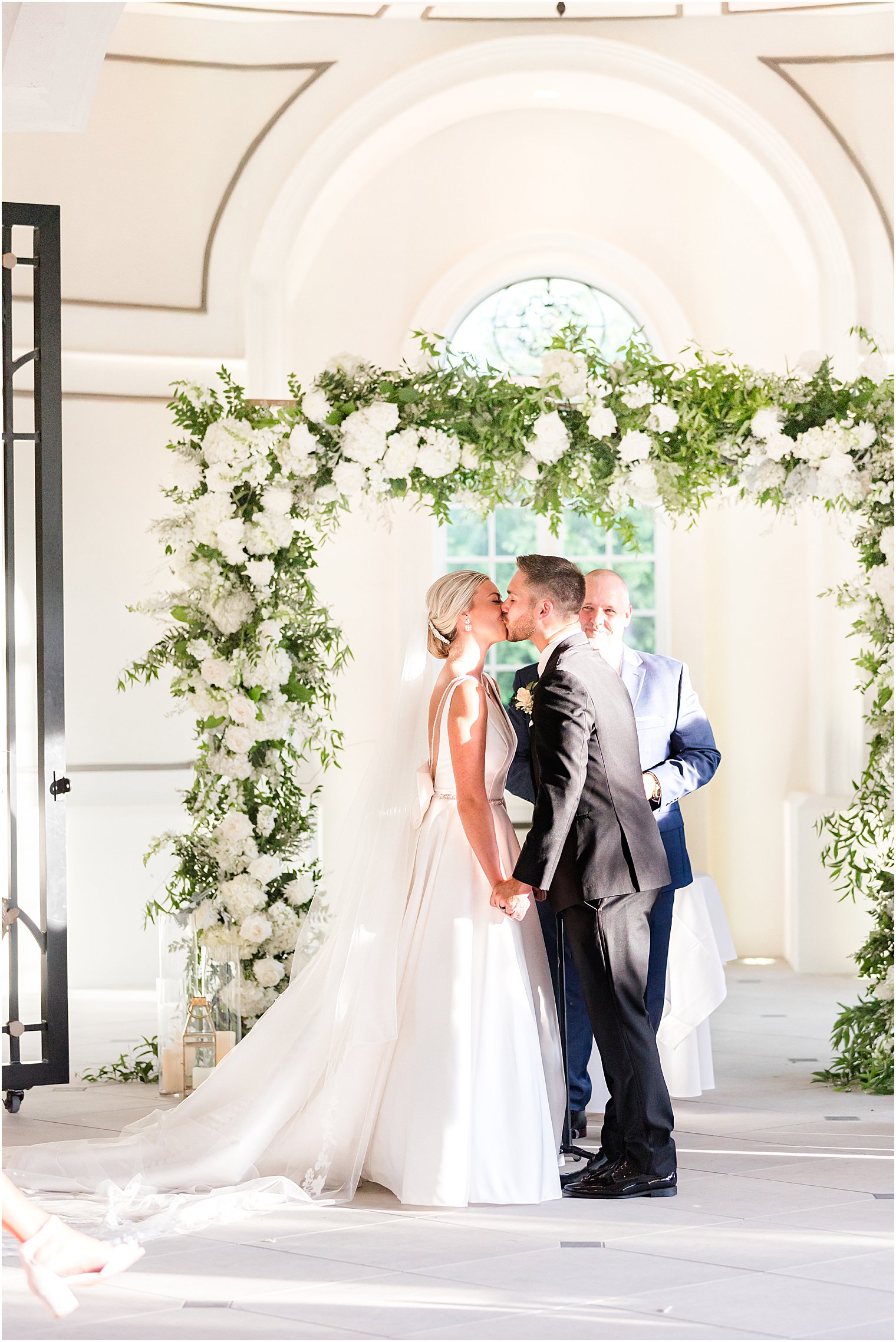 bride and groom kiss during wedding ceremony in New Jersey