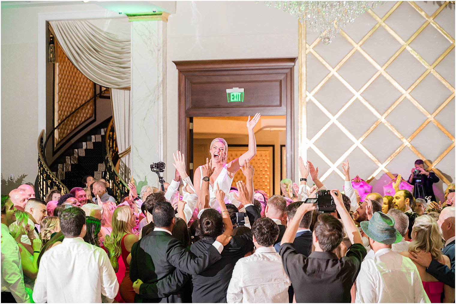 guests lift bride up during Shadowbrook NJ wedding reception