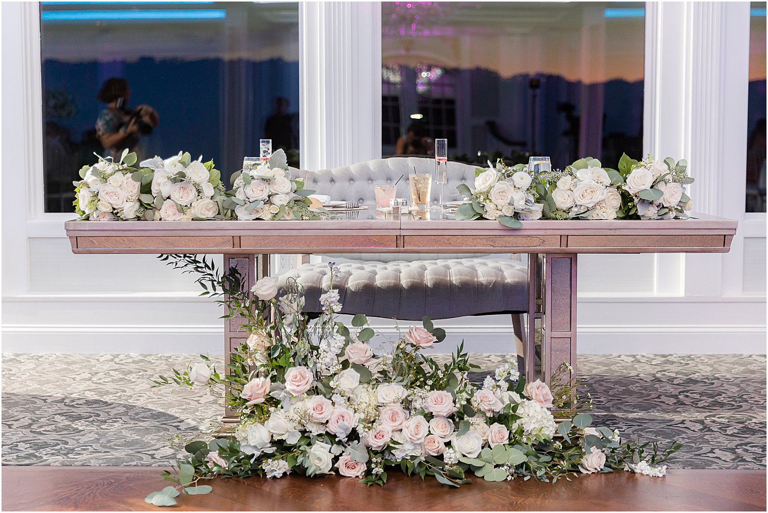 sweetheart table with ivory flowers at The Mill Lakeside Manor