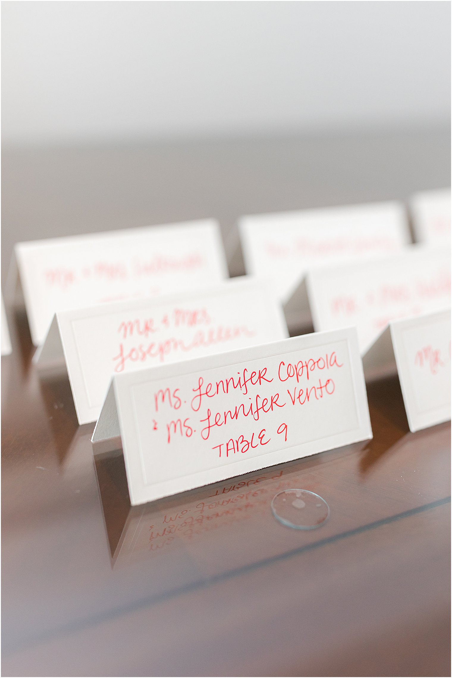 bright seating cards with hand calligraphy