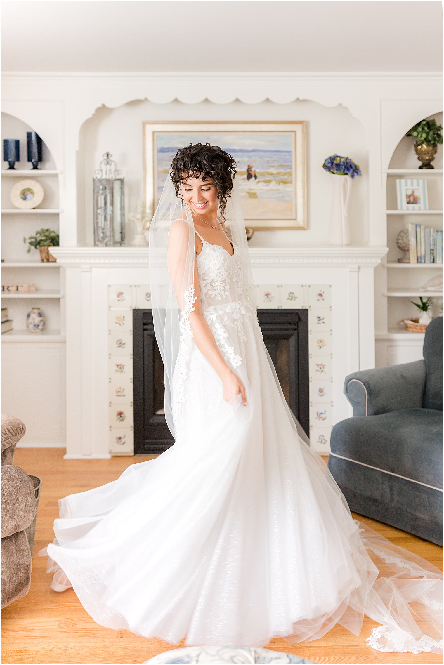 bride twirls wedding gown in living room
