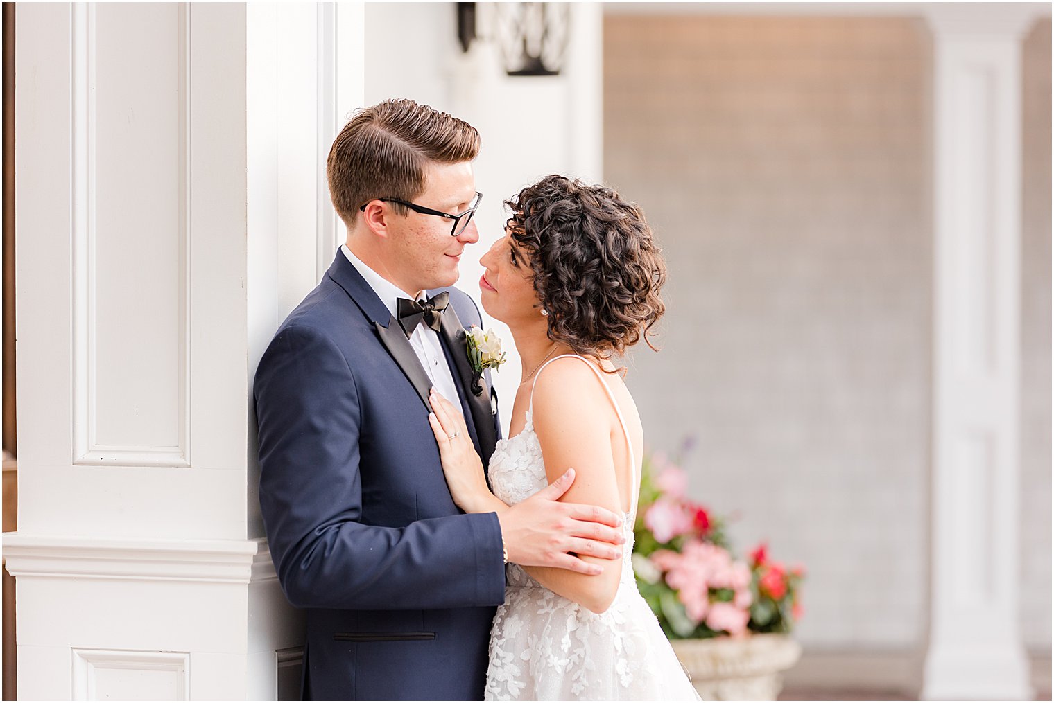 bride looks up at groom during portraits at The Mill Lakeside Manor