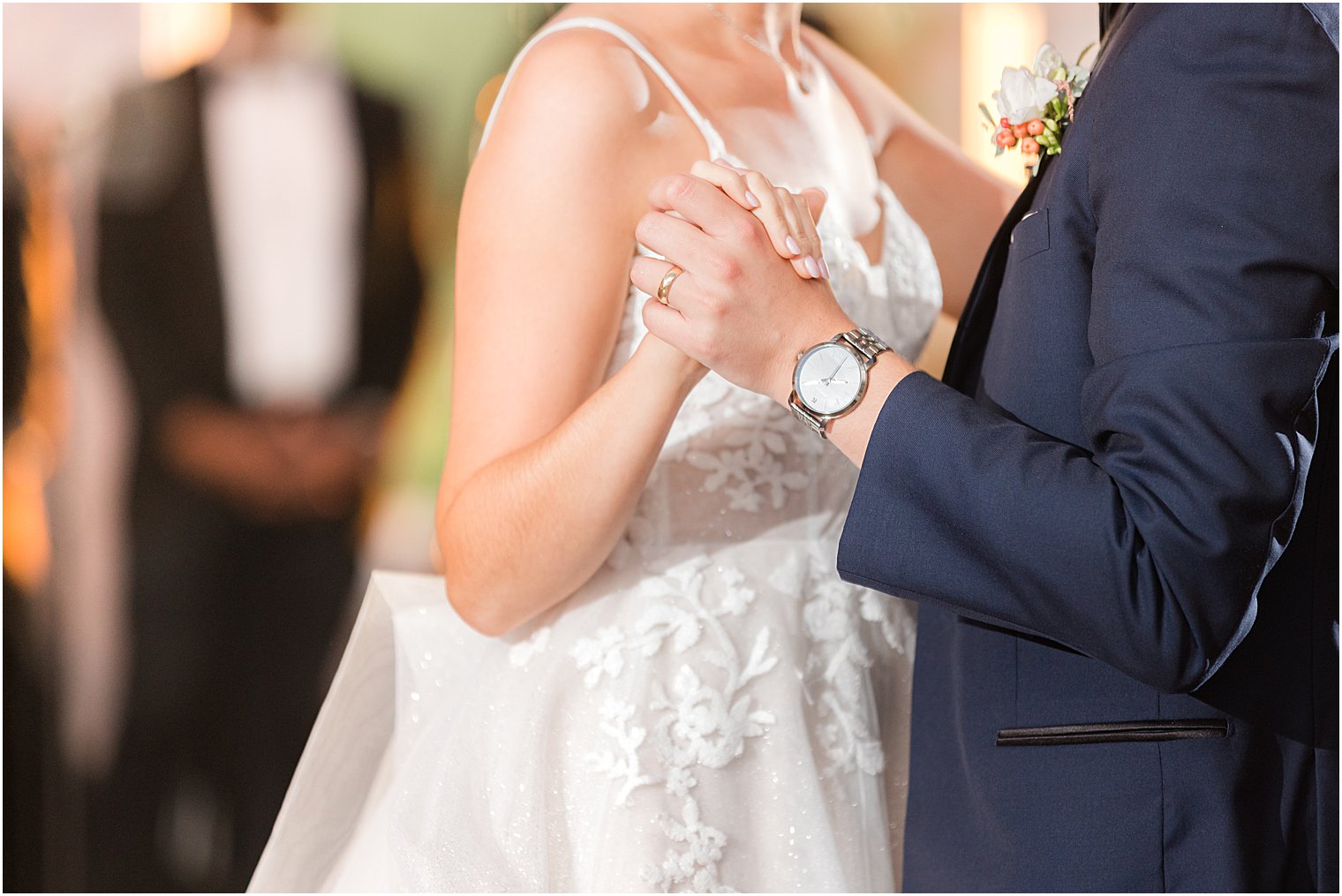 couple holds hands dancing at Spring Lake NJ wedding reception