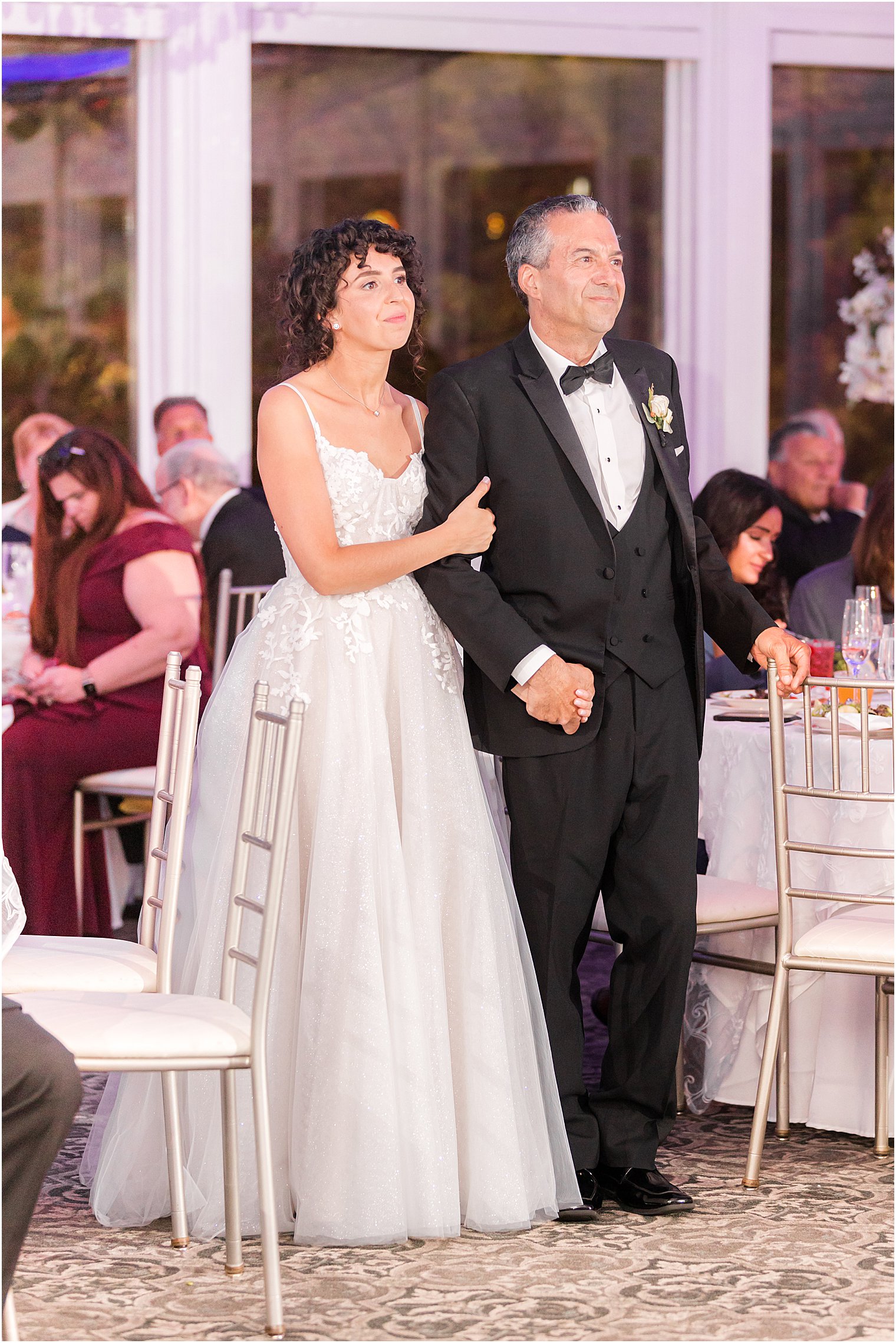 bride and dad watch dance floor