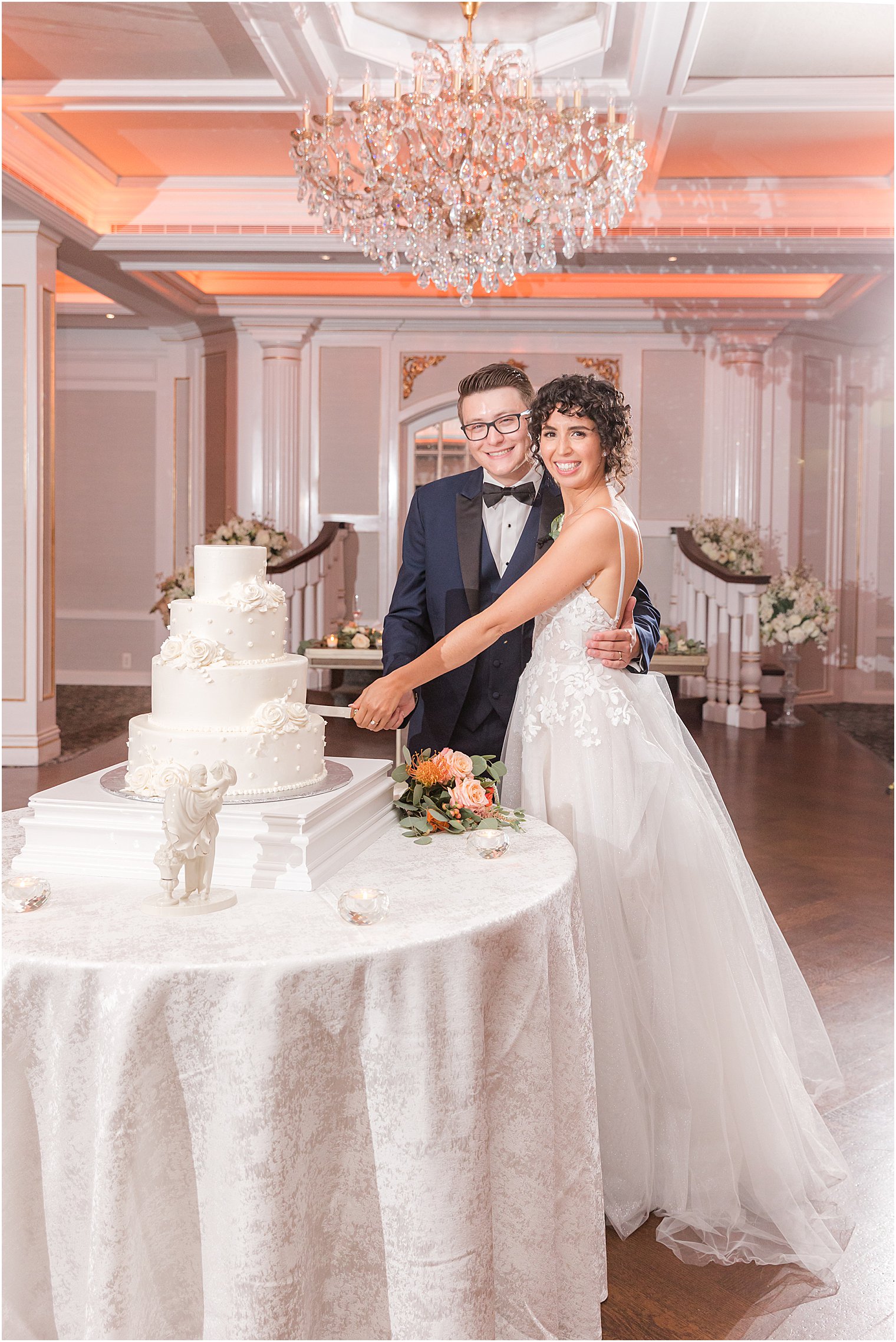 newlyweds cut wedding cake at Spring Lake NJ wedding reception