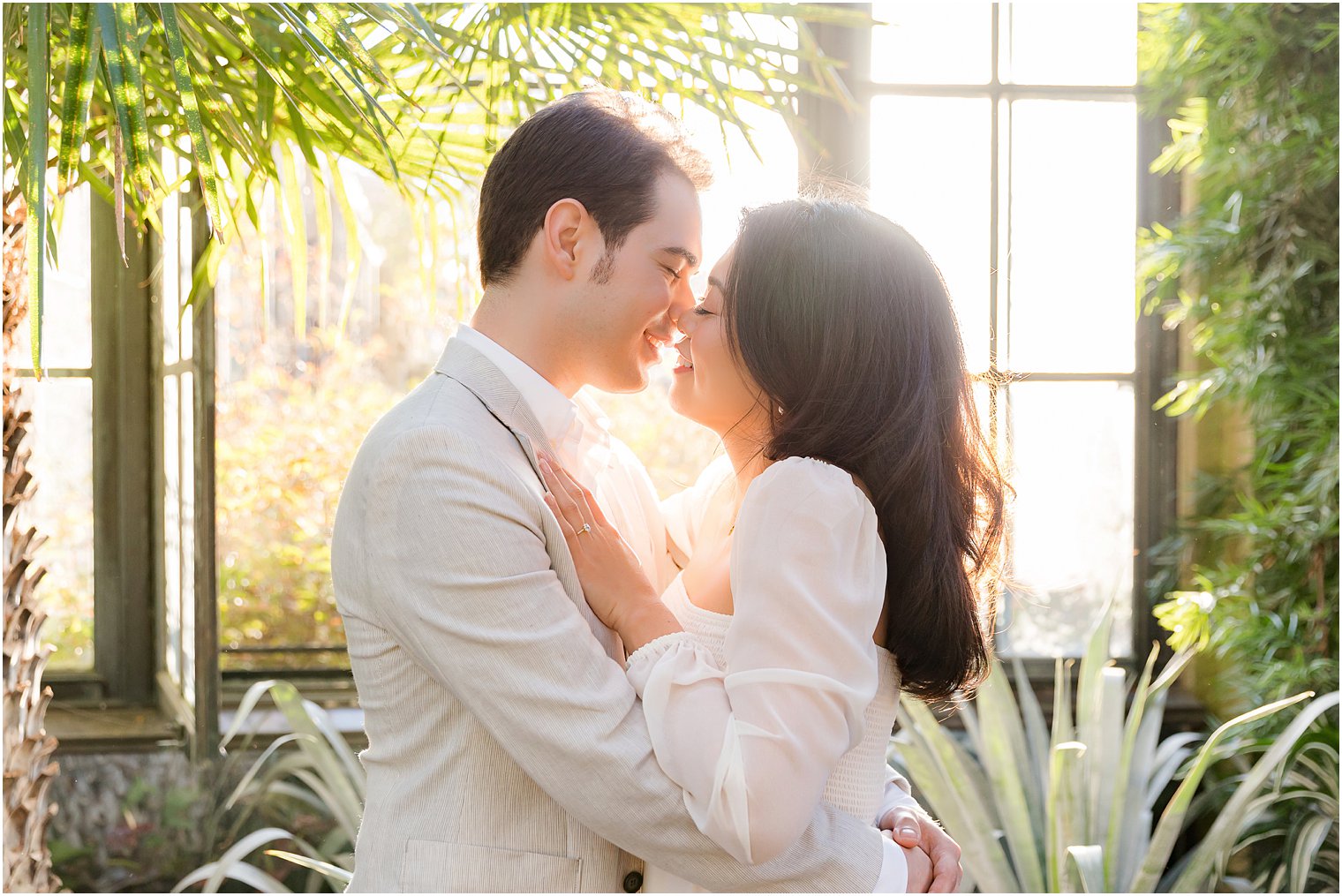 couple hugs together leaning for kiss