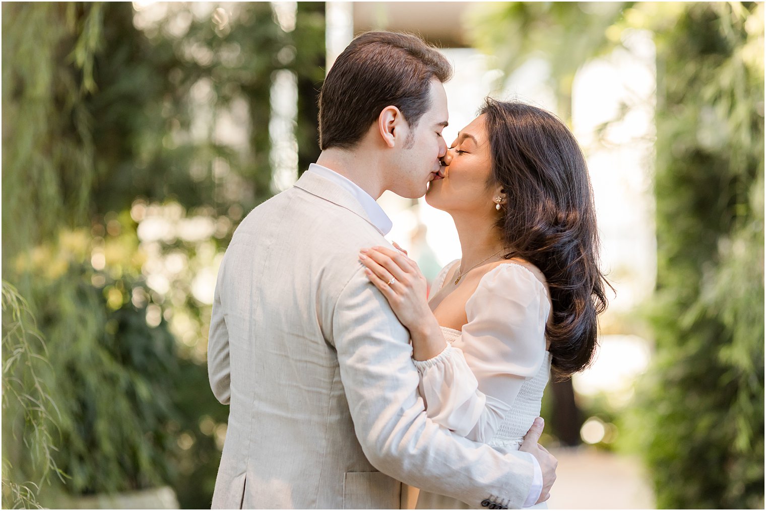 couple kisses together in Longwood Gardens