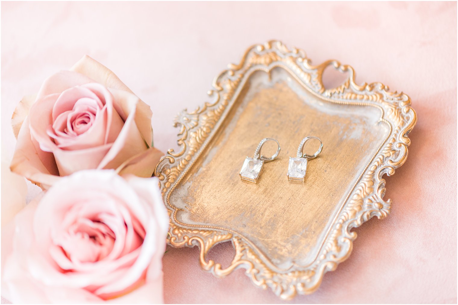 bride's diamond earrings on gold try before NJ wedding