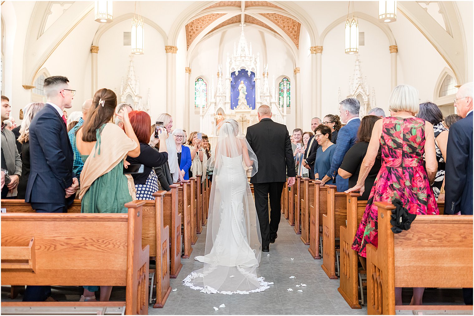 dad escorts bride down aisle for traditional church wedding at St. Mary's Catholic Church