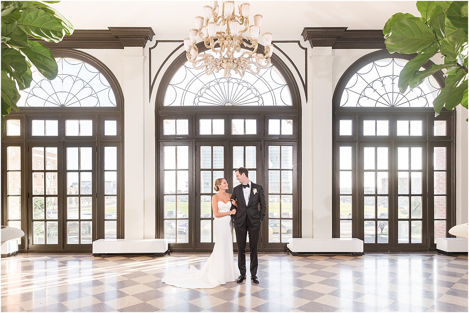 bride and groom pose in lobby of Berkeley Oceanfront Hotel