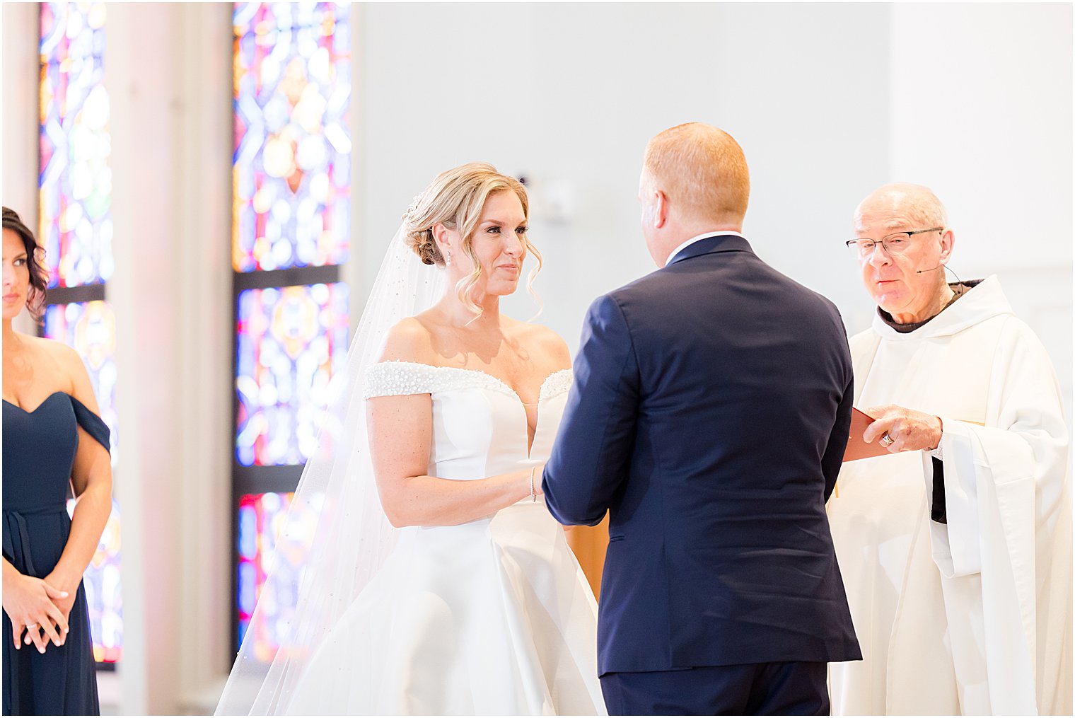 bride smiles exchanging vows during traditional church wedding on Long Beach Island