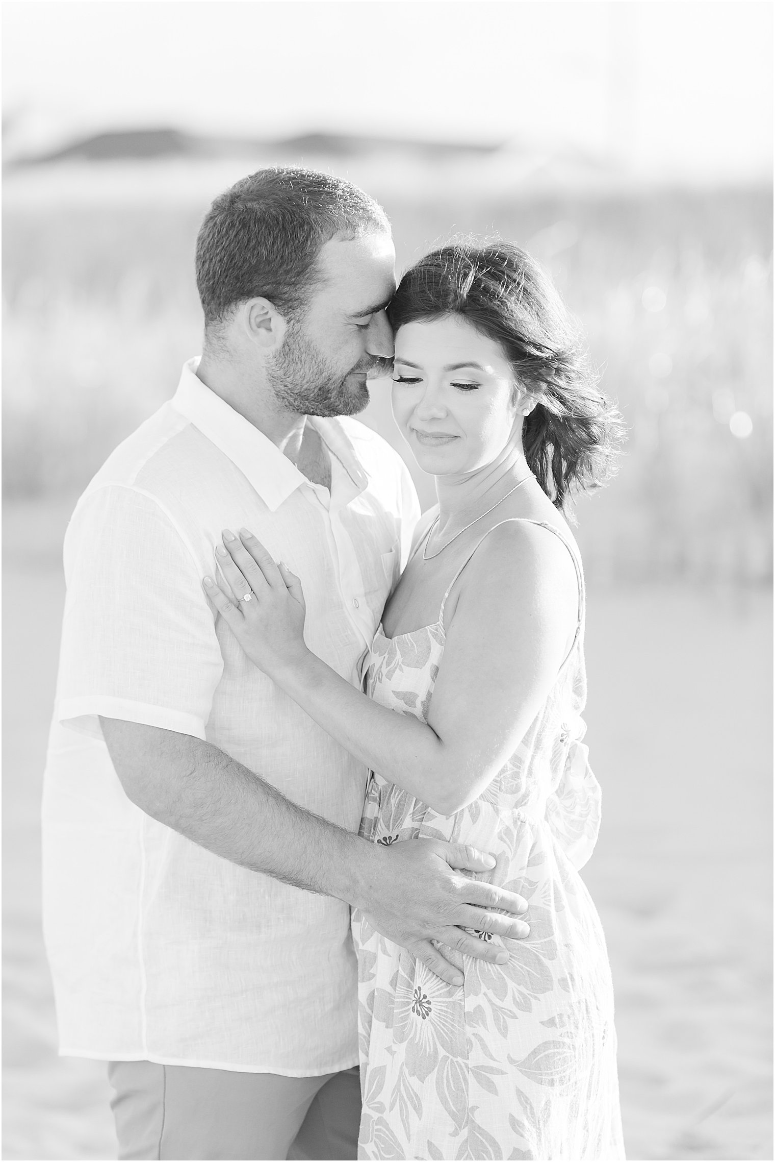 groom nuzzles bride's cheek on Lavallette Beach