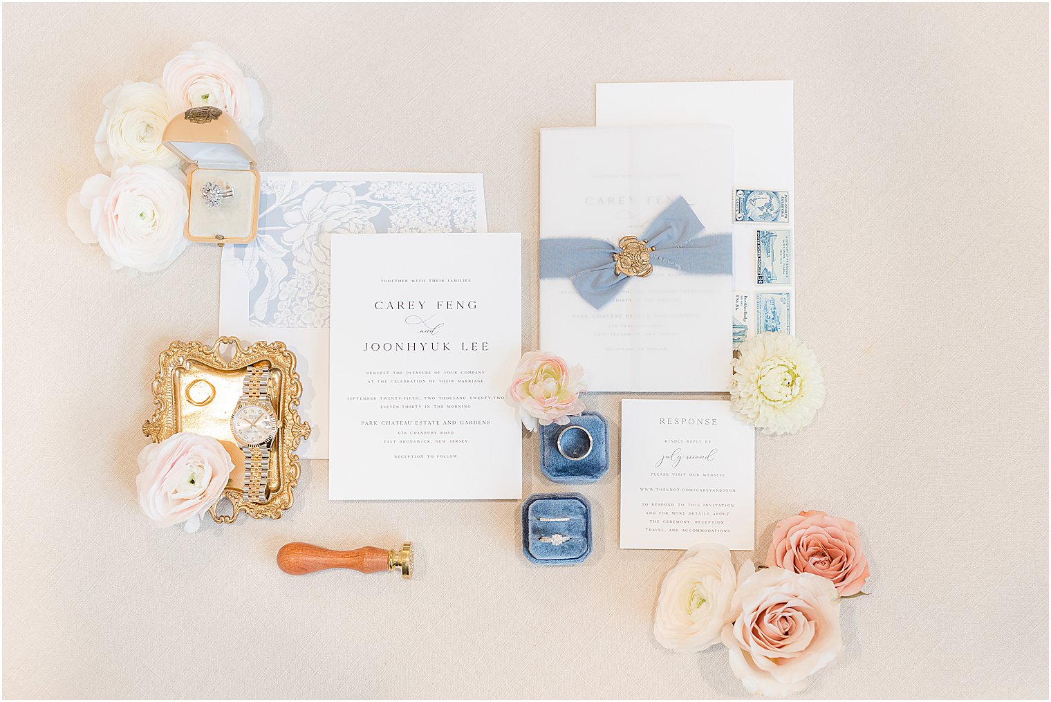 invitation suite from Shine Wedding with blue ribbon and gold wax seal