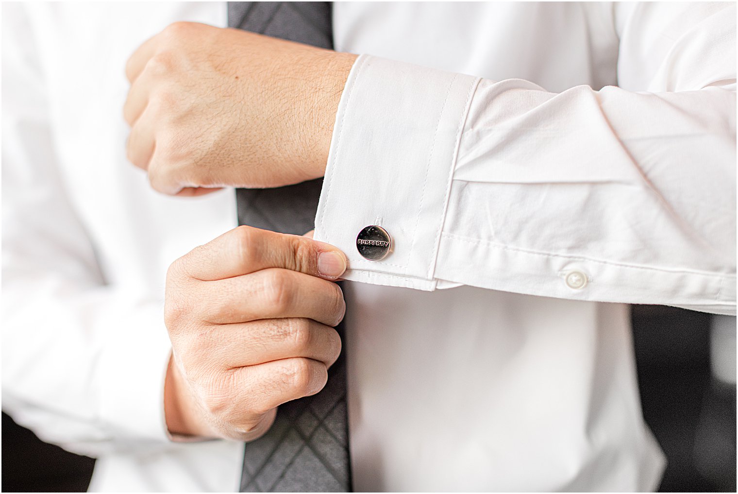 groom shows off custom cufflinks for NJ wedding day