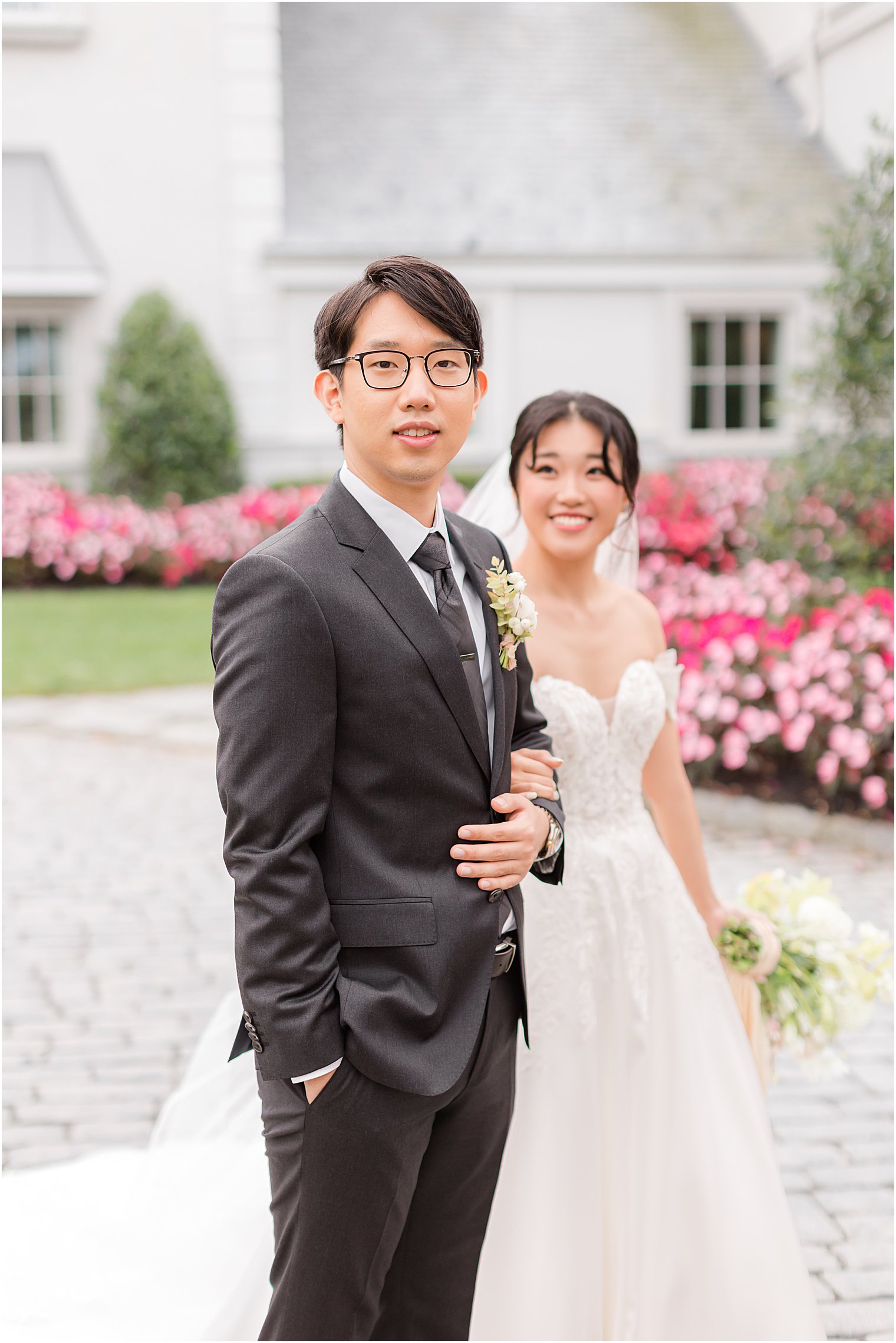 bride and groom walk outside Park Chateau Estate