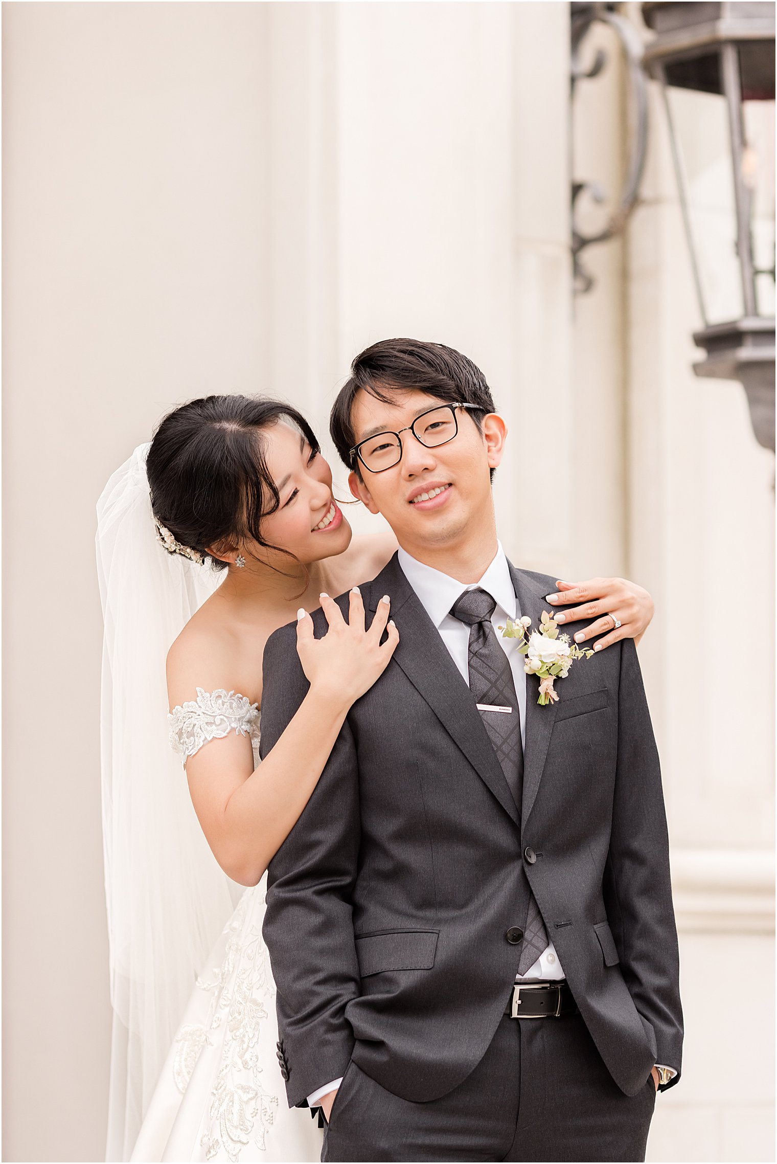 bride hugs groom from behind in New Jersey 