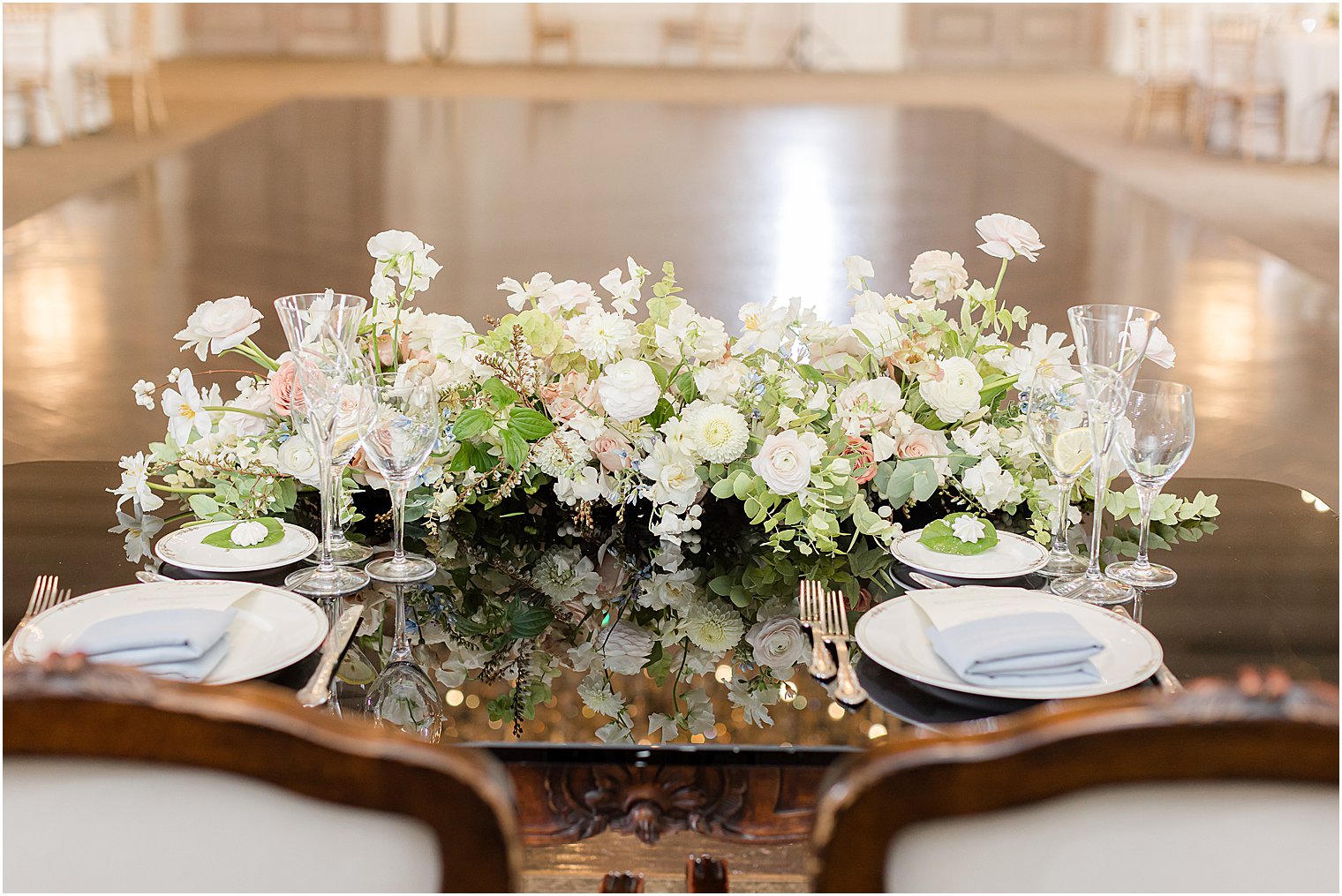 sweetheart table with ivory and pink flowers 
