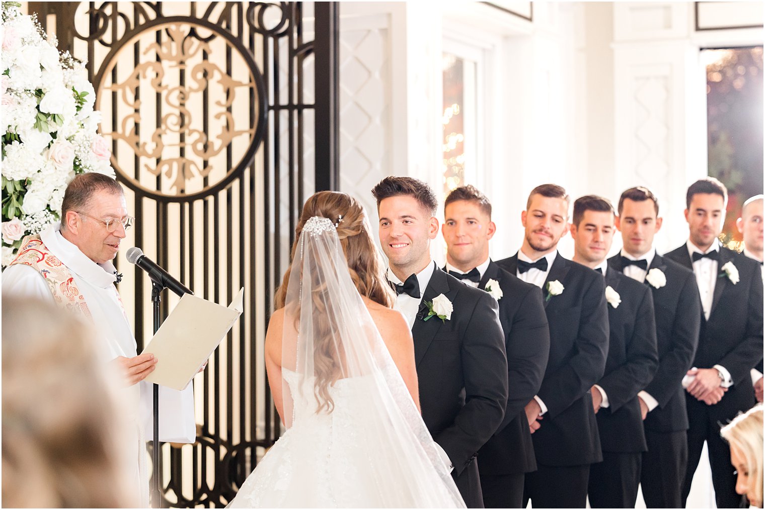 bride and groom exchange vows during ceremony at Shadowbrook at Shrewsbury wedding