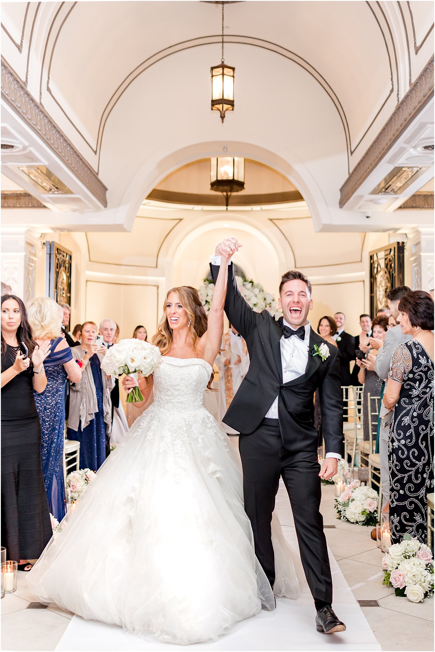 newlyweds cheer leaving chapel at Shadowbrook at Shrewsbury