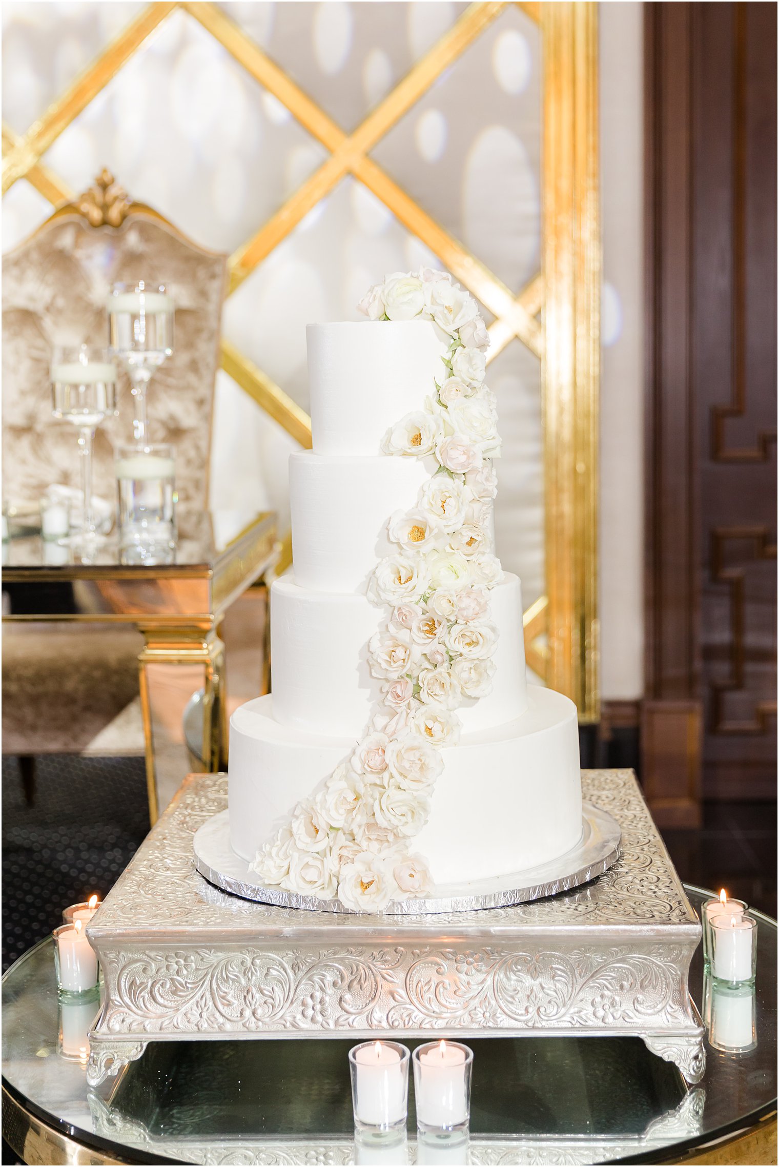 tiered wedding cake with gold details at Shadowbrook at Shrewsbury