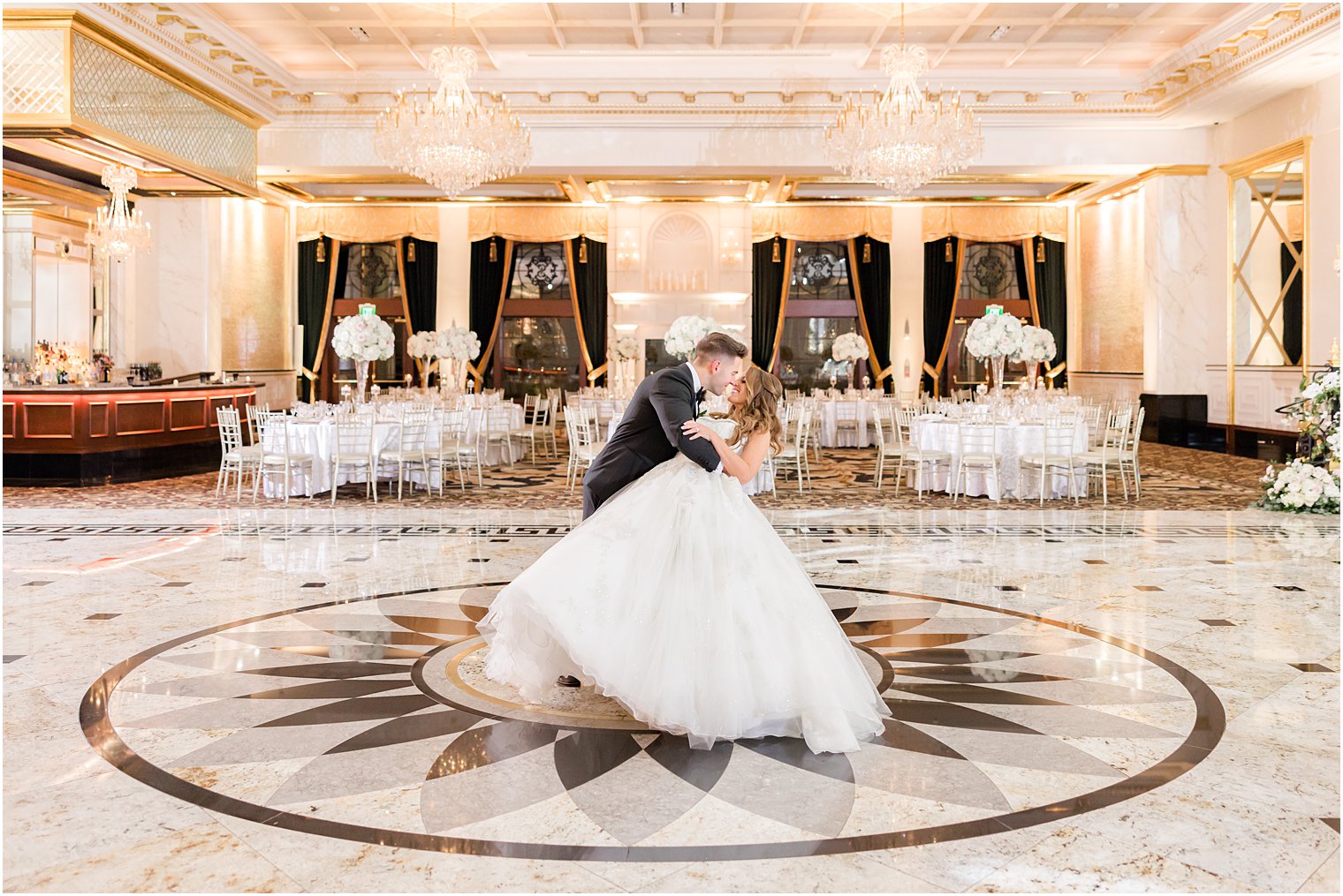 groom dips bride in ballroom at Shadowbrook at Shrewsbury