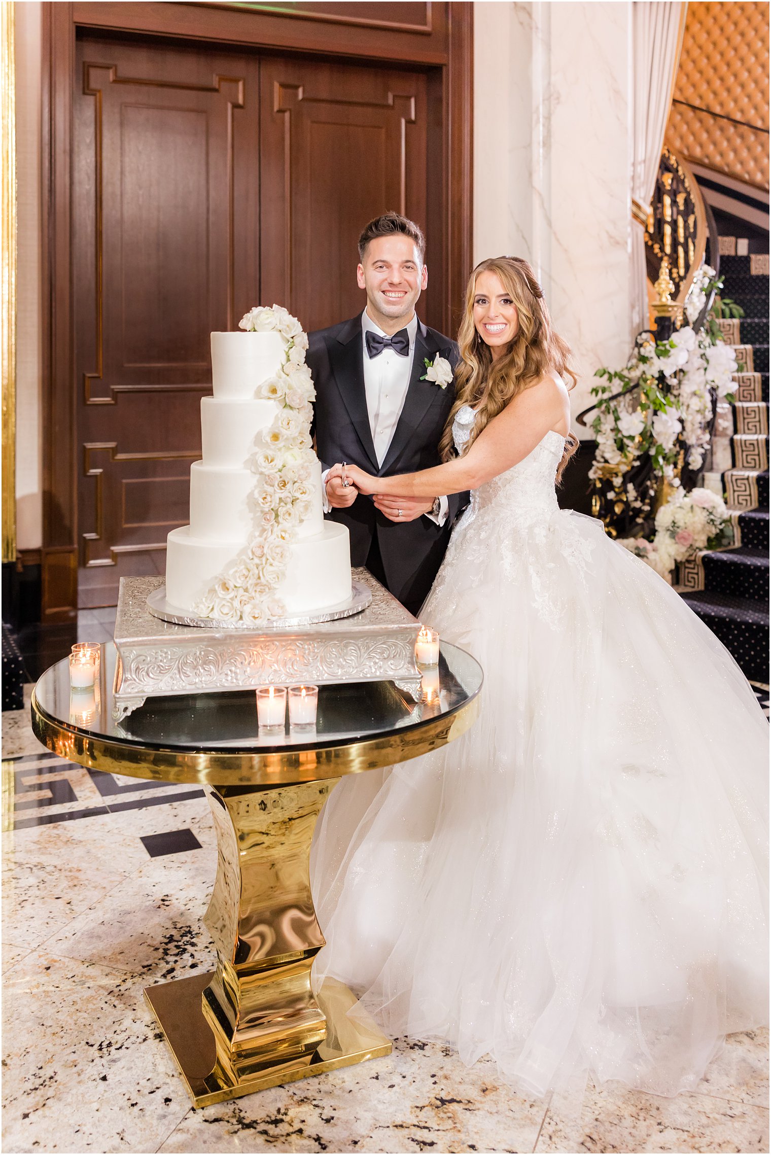 newlyweds cut wedding cake at Shadowbrook at Shrewsbury