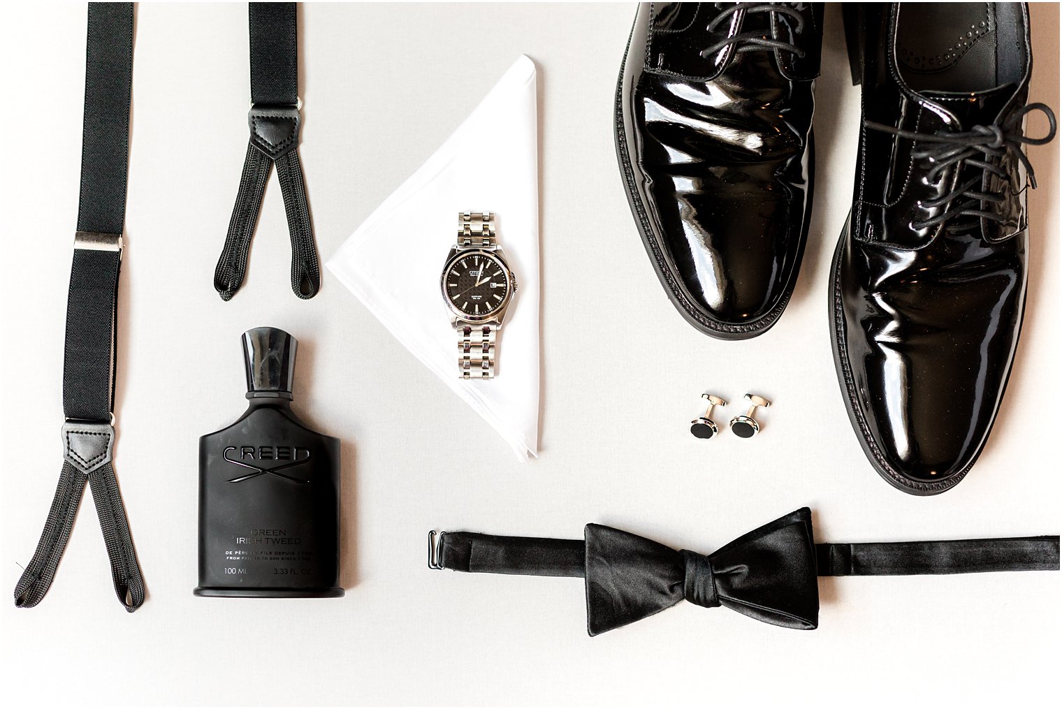 groom's classic black shoes and suspenders for NJ wedding 