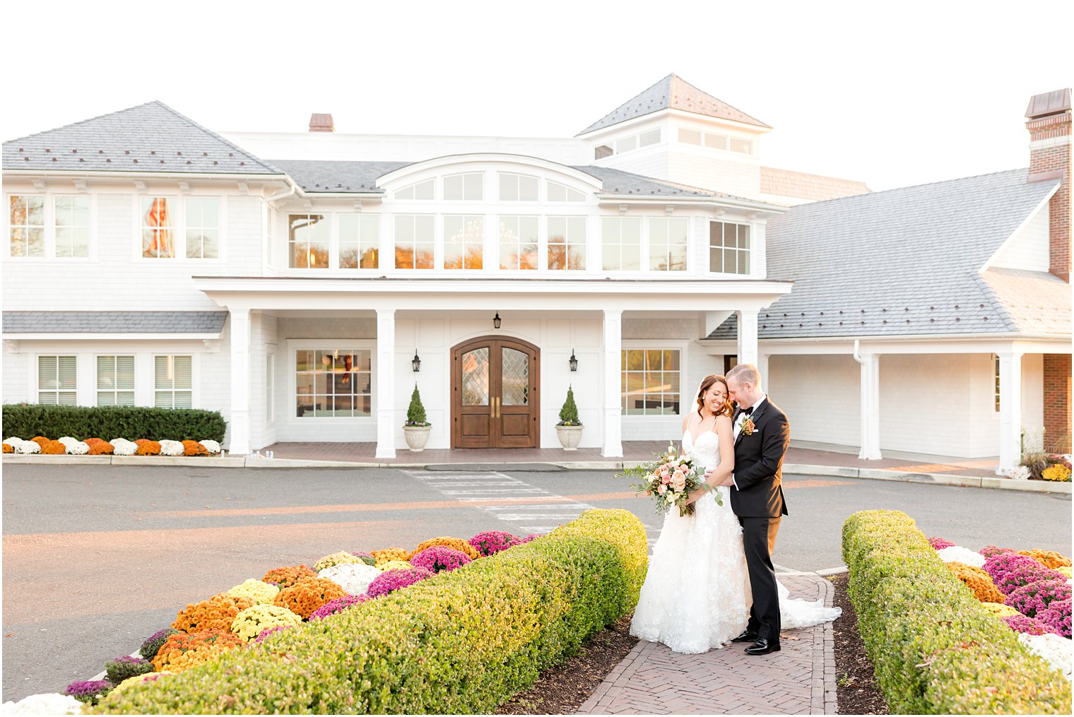 bride and groom hug outside The Mill Lakeside Manor