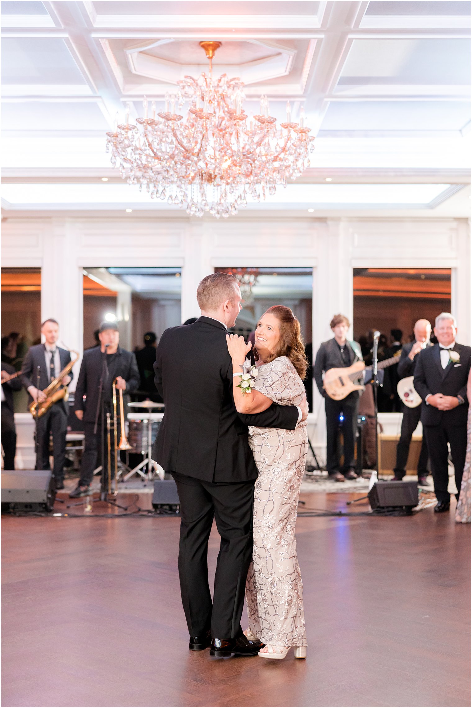 groom dances with mother at The Mill Lakeside Manor 