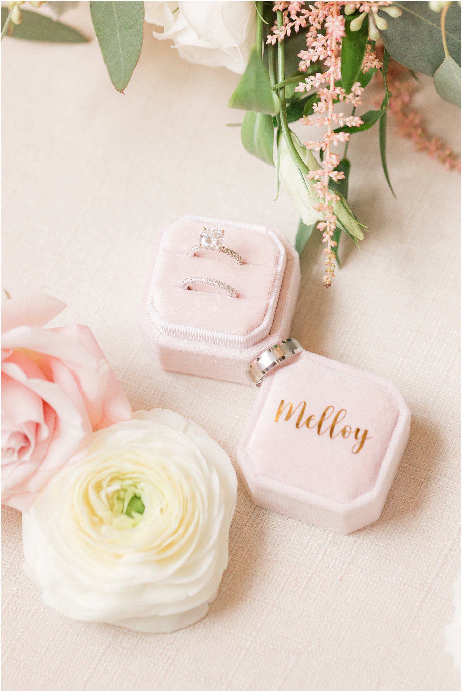 wedding rings rest in pink box during prep for fall wedding at the Mill Lakeside Manor