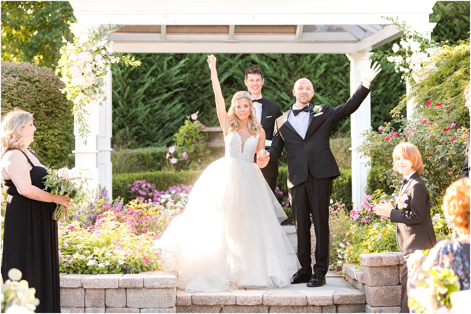 newlyweds cheer after ceremony during fall wedding at The Mill Lakeside Manor