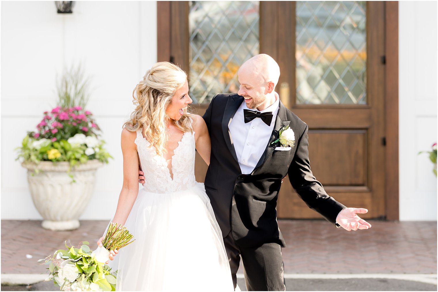 bride and groom laugh bumping hips in New Jersey 