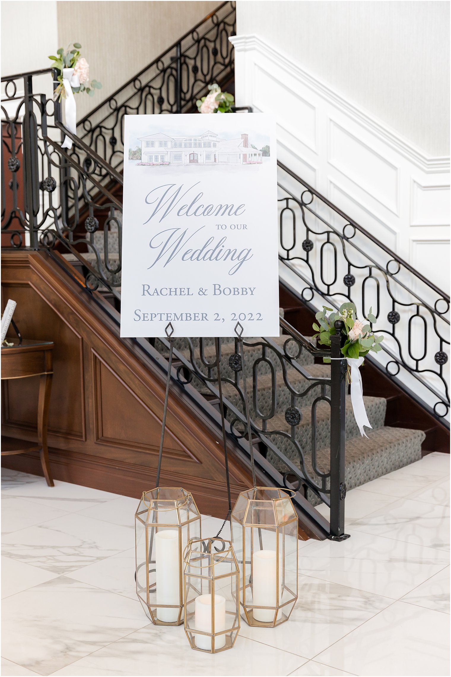 welcome sign by staircase in The Mill Lakeside Manor