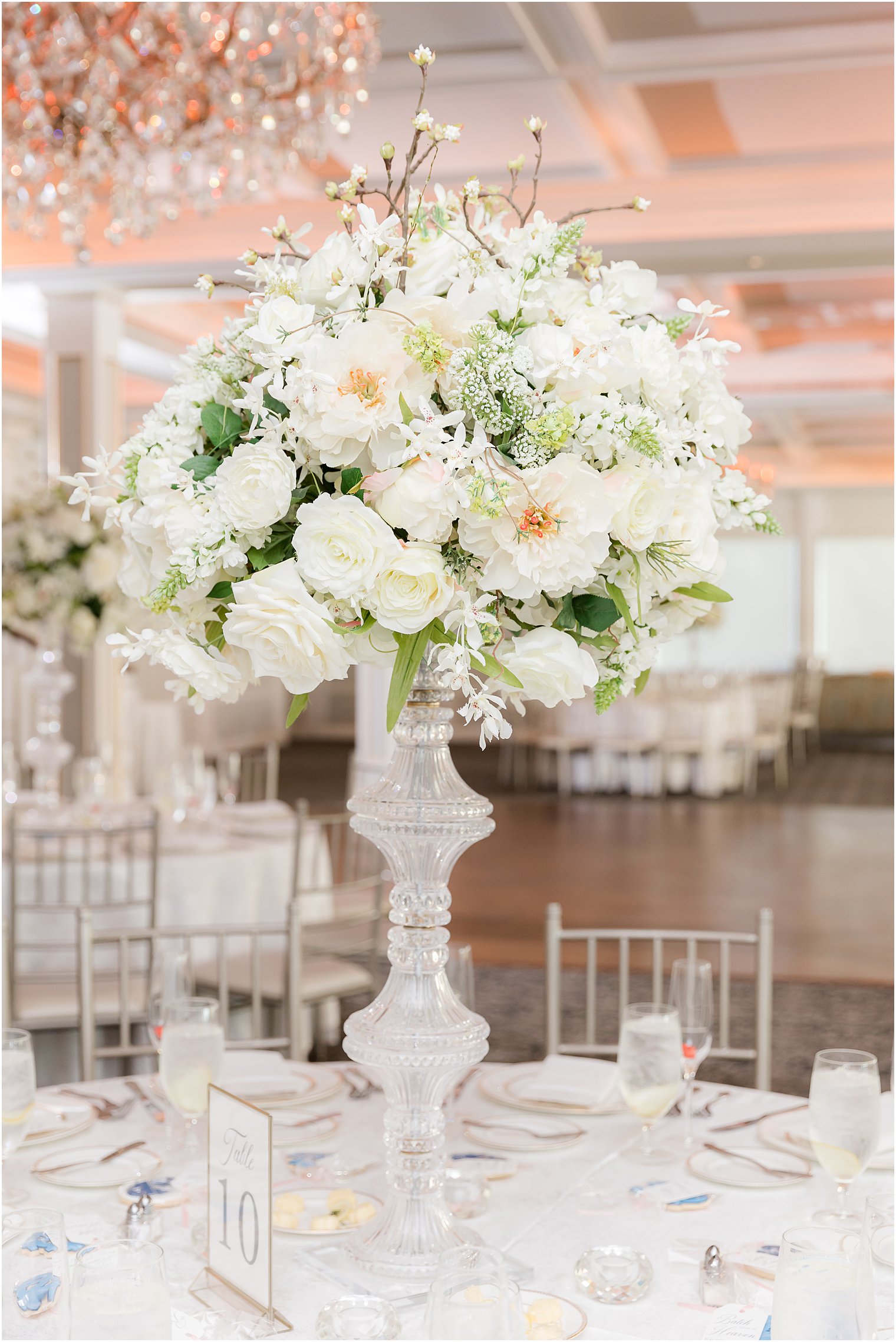 tall floral centerpieces at The Mill Lakeside Manor