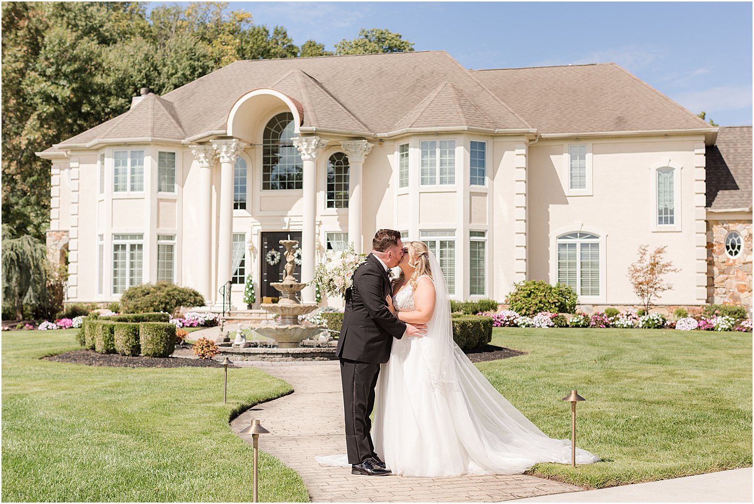 bride and groom kiss during first look