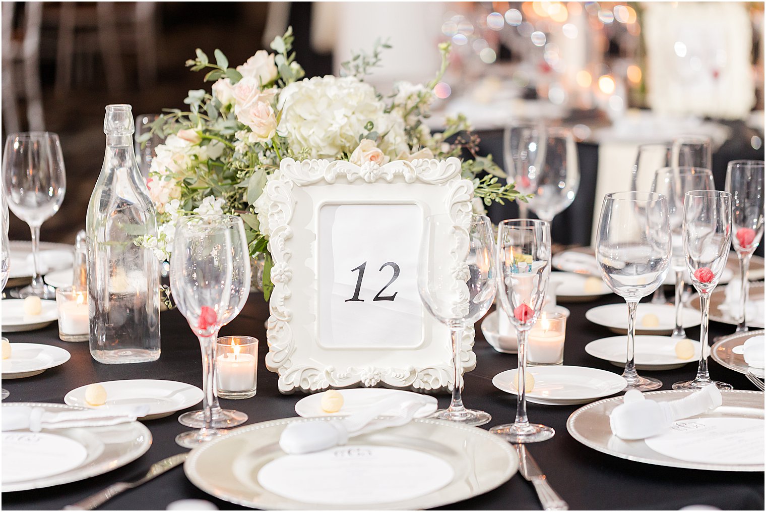 place setting with ivory plates and frames at Vie by Cescaphe
