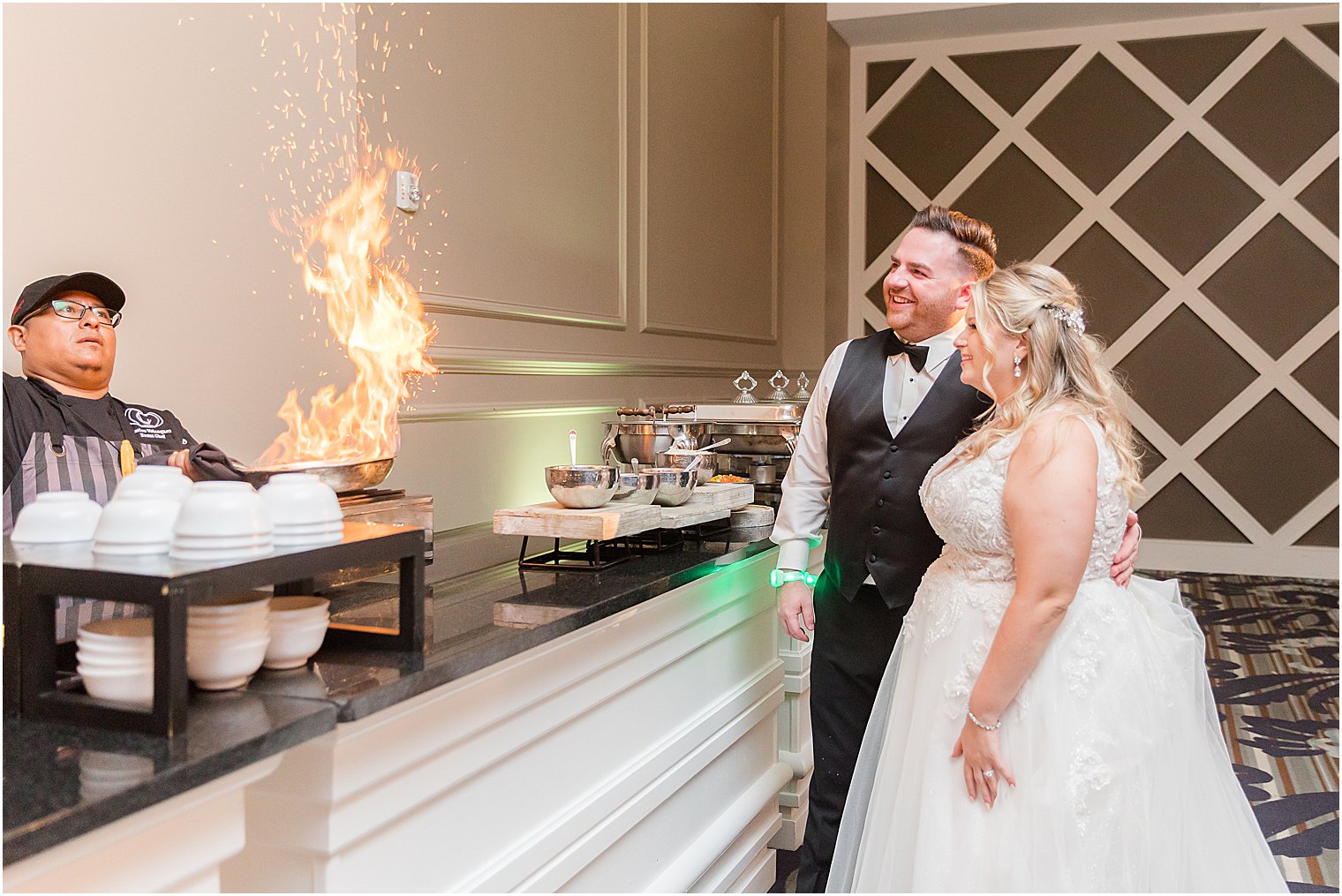 bride and groom watch flambe during Philly wedding reception
