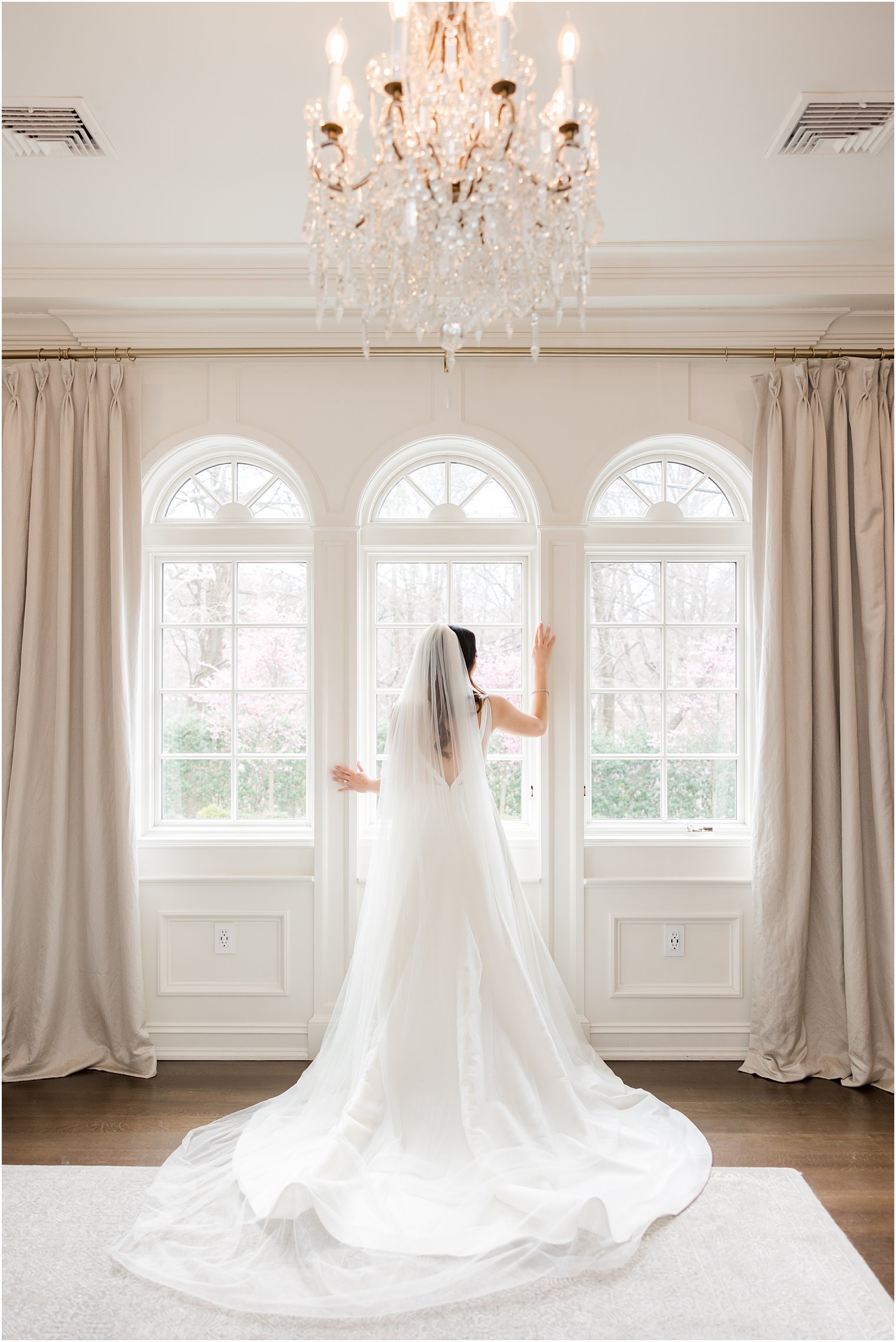 bride poses in window at Nanina's in the Park