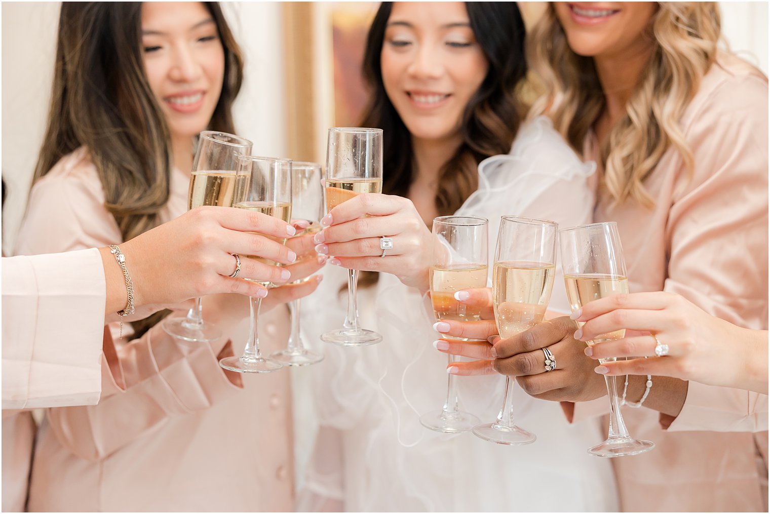 bridesmaids toast champagne during prep for New Jersey wedding 
