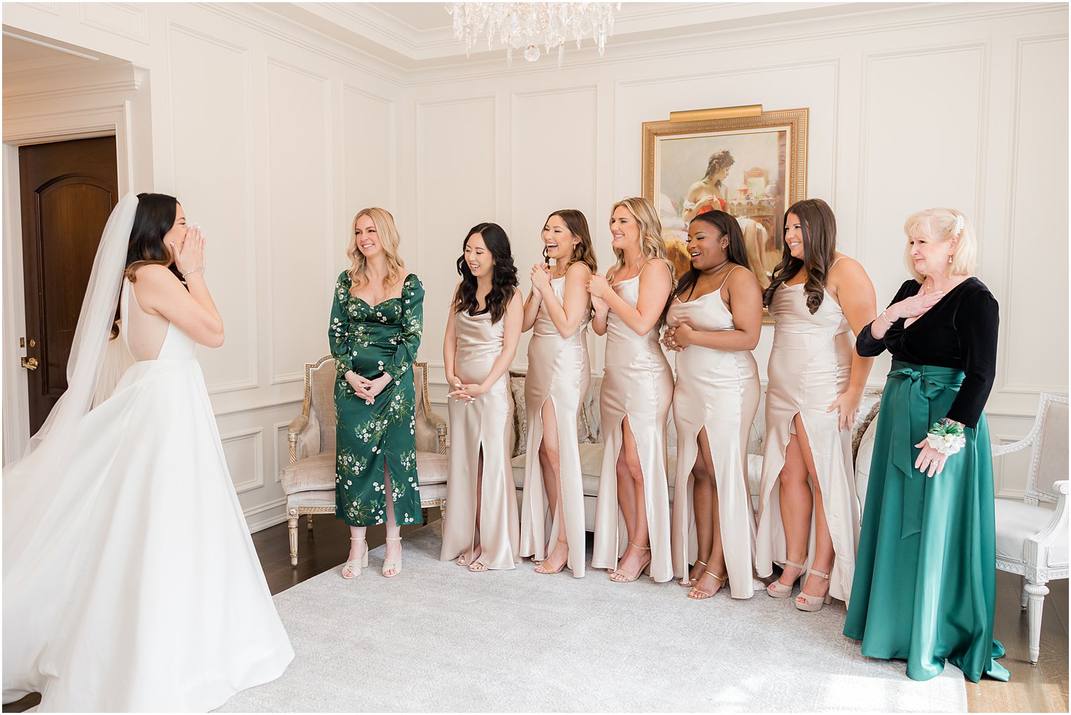 bride has first look in suite at Nanina's in the Park with bridesmaids in mothers 