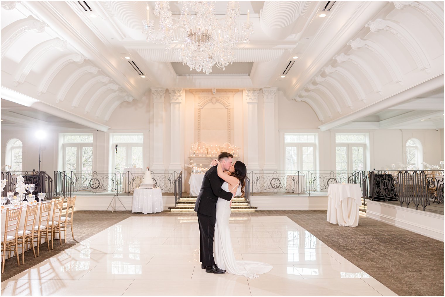 groom dips bride kissing her in ballroom at Nanina's in the Park