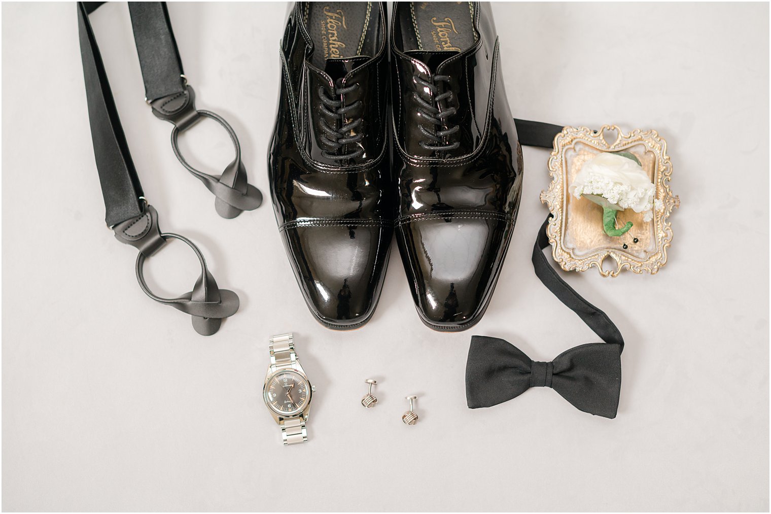 groom's black shoes, tie, and suspenders for NJ wedding