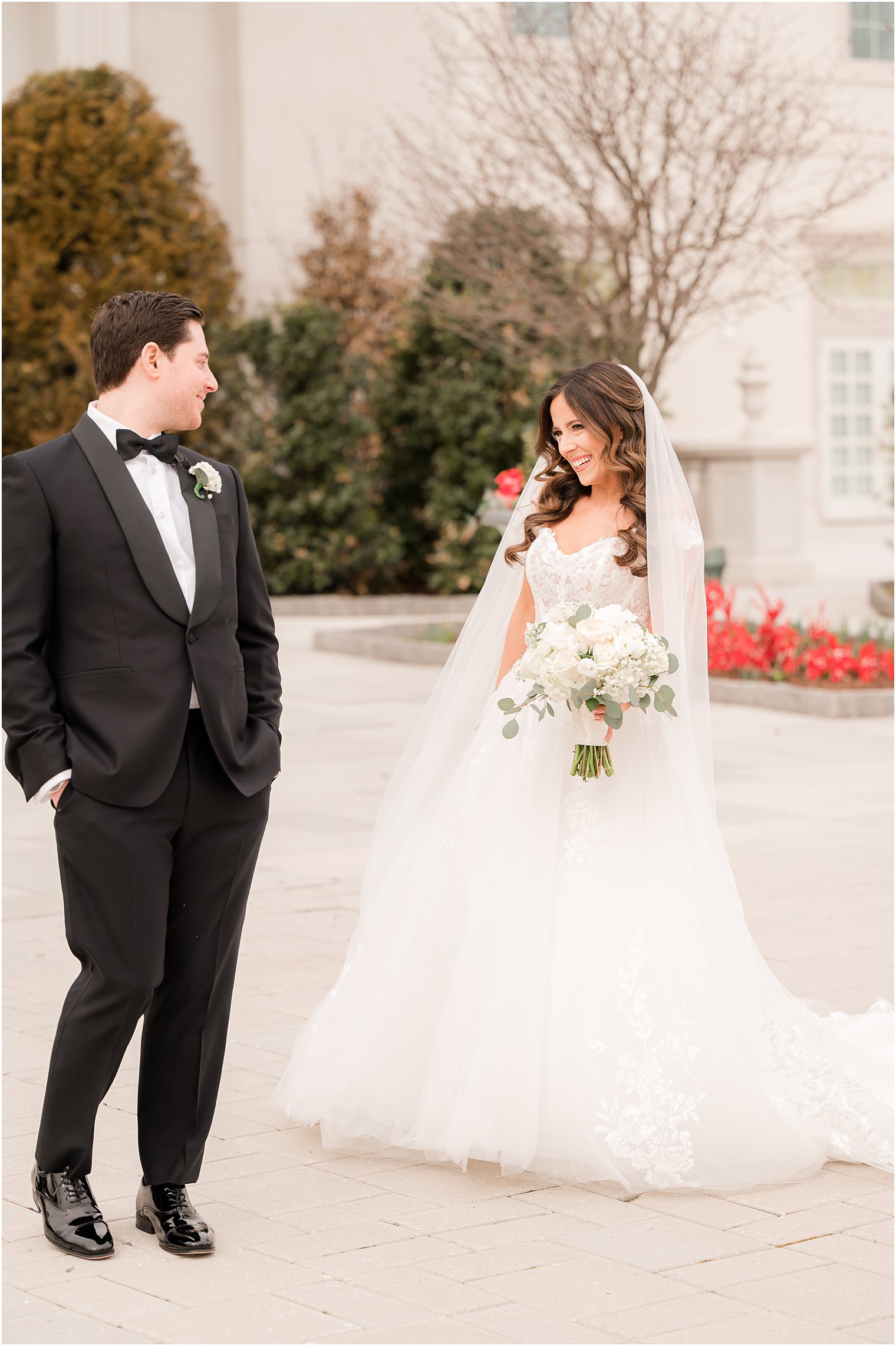 groom turns to look at bride during first look outside the Palace at Somerset Park