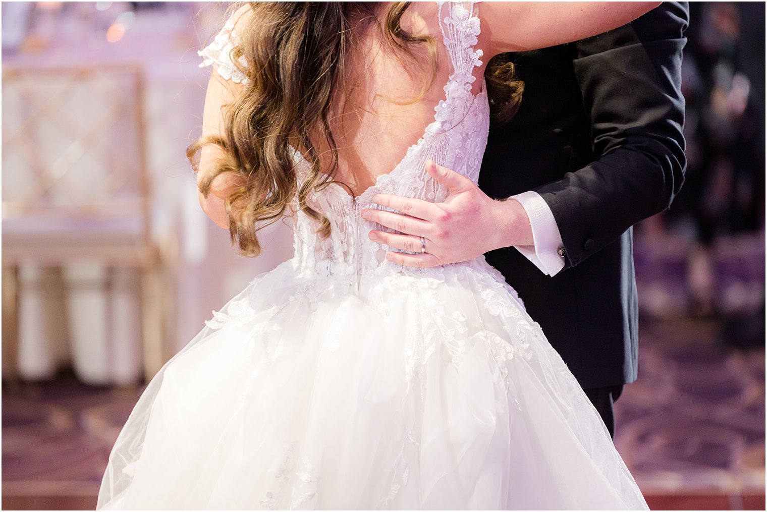 groom holds bride's waist during dance at the Palace at Somerset Park