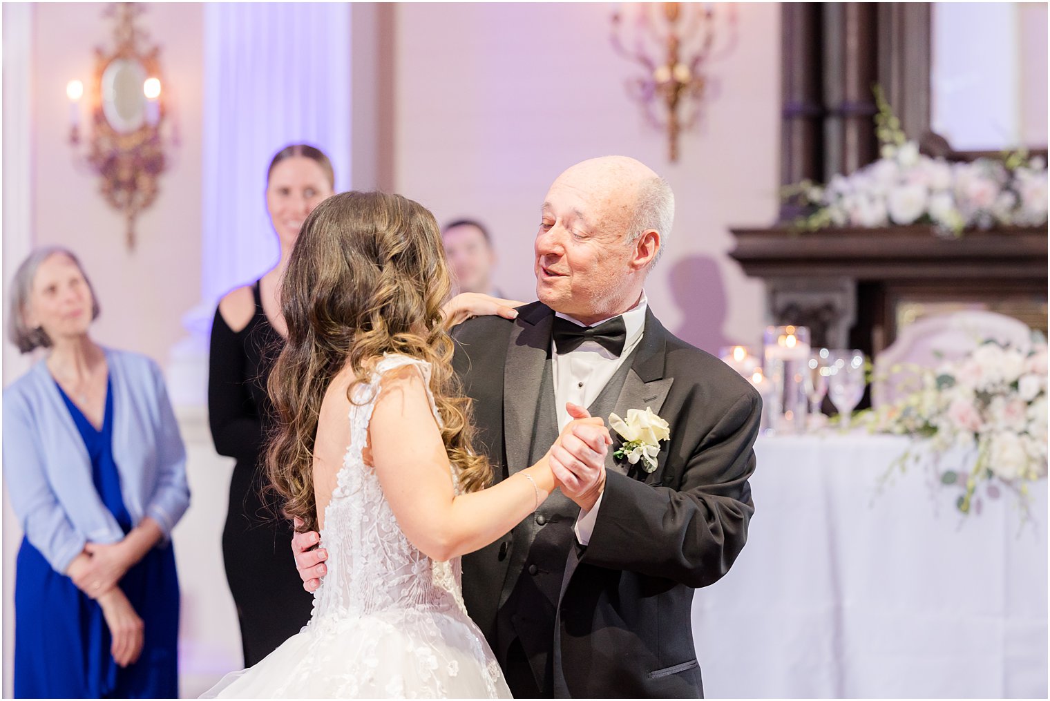 bride and father laugh together during dance 