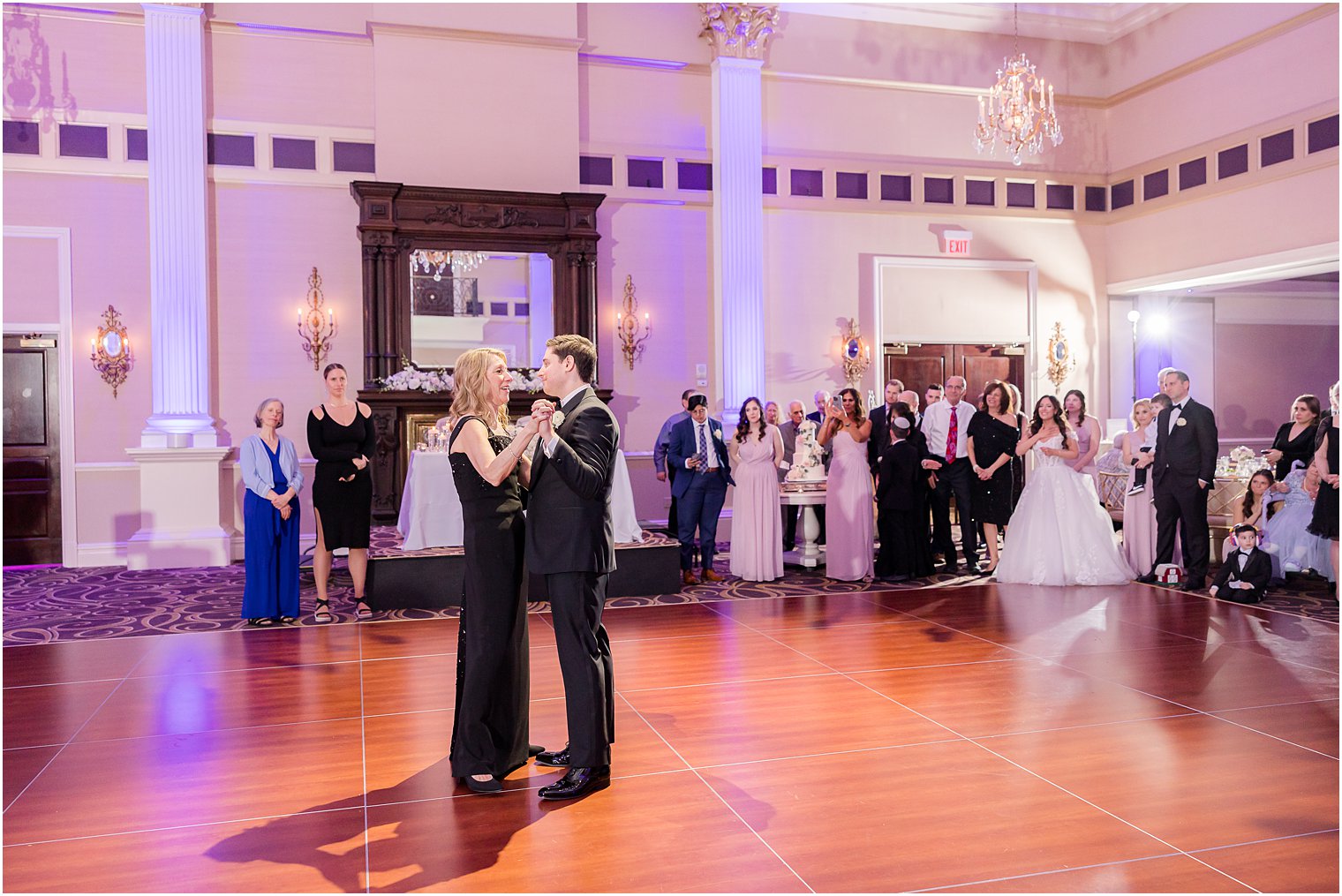 groom dances with mother in ballroom at the Palace at Somerset Park