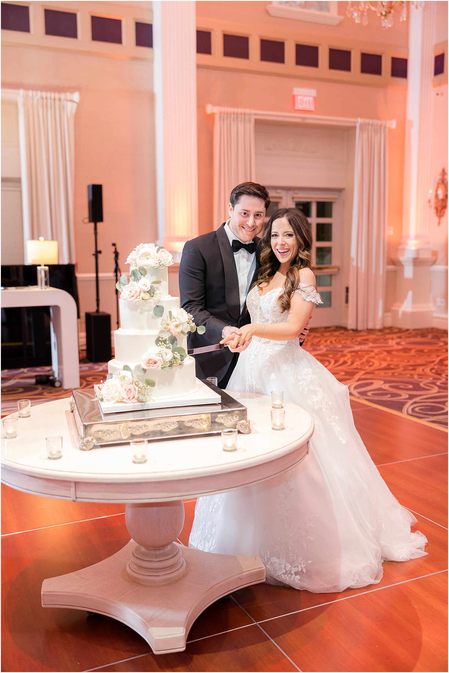 bride and groom cut wedding cake on dance floor at the Palace at Somerset Park