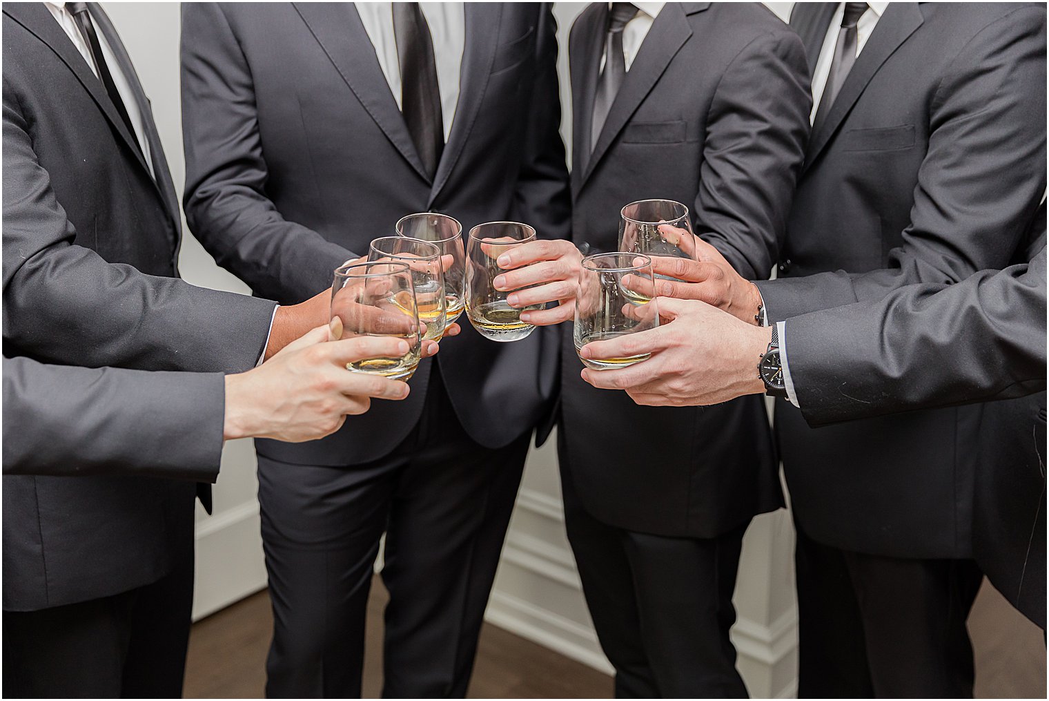 groom and groomsmen toast drinks in New Jersey 