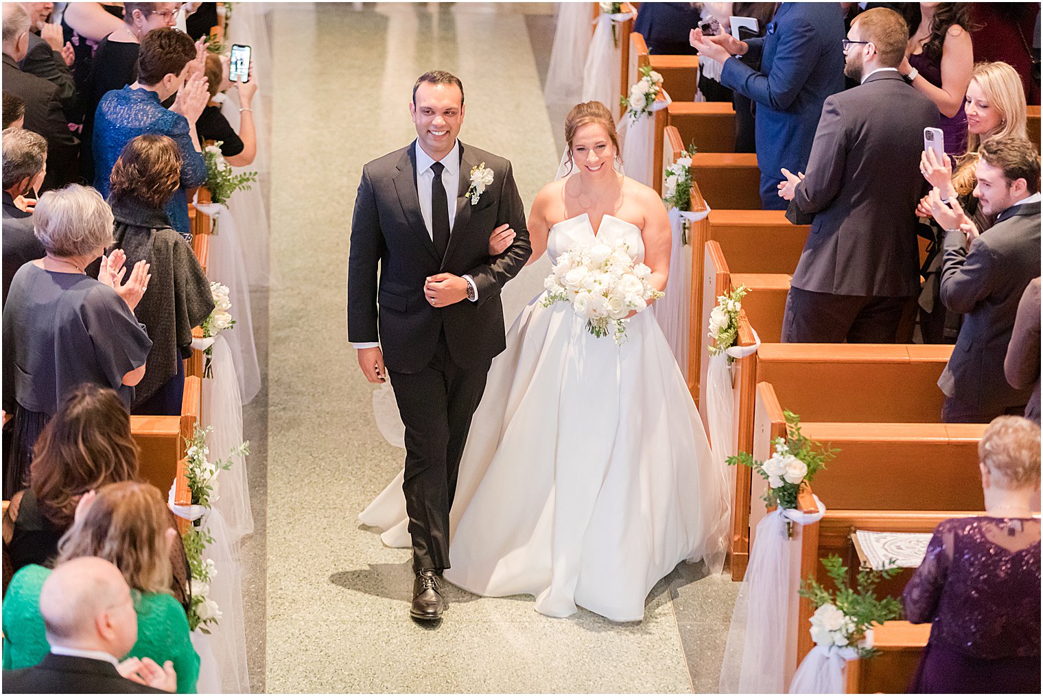 bride walks down aisle at the Immaculate Conception Chapel at Mount Saint Mary Academy