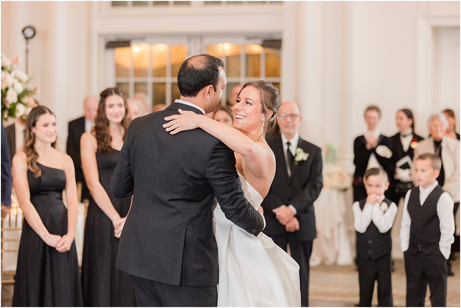 bride hugs groom during first dance at Park Chateau Estate